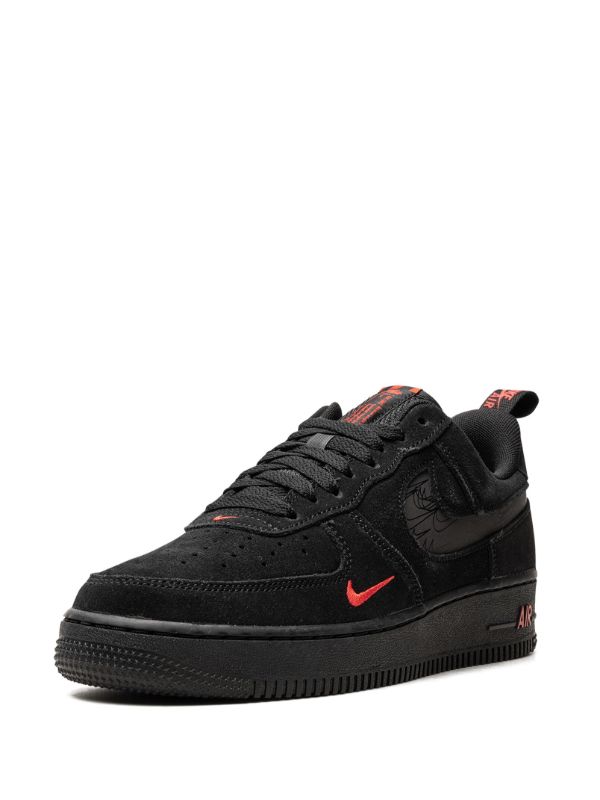 Nike Air Force 1 shoes featuring black and red